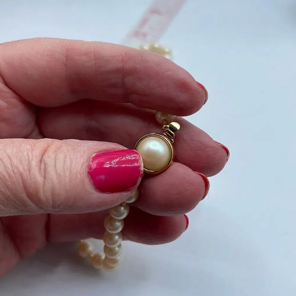 Vintage faux glass pearls. Hand knotted & 16”
